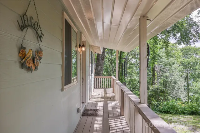 a view of a balcony with wooden floor
