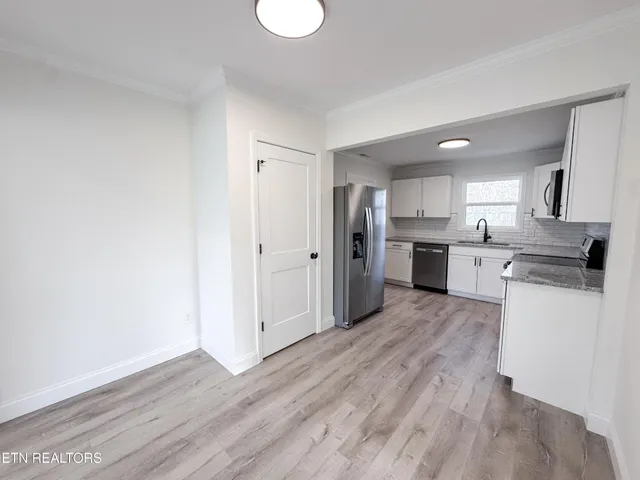 a view of kitchen with wooden floor