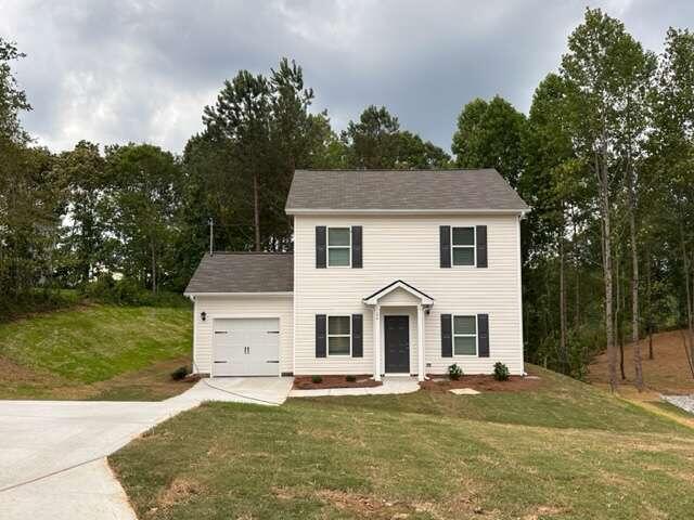 317 Lambert Overlook Circle Carrollton, GA 30117 - Photo 1 of 1 a view of a house with garden