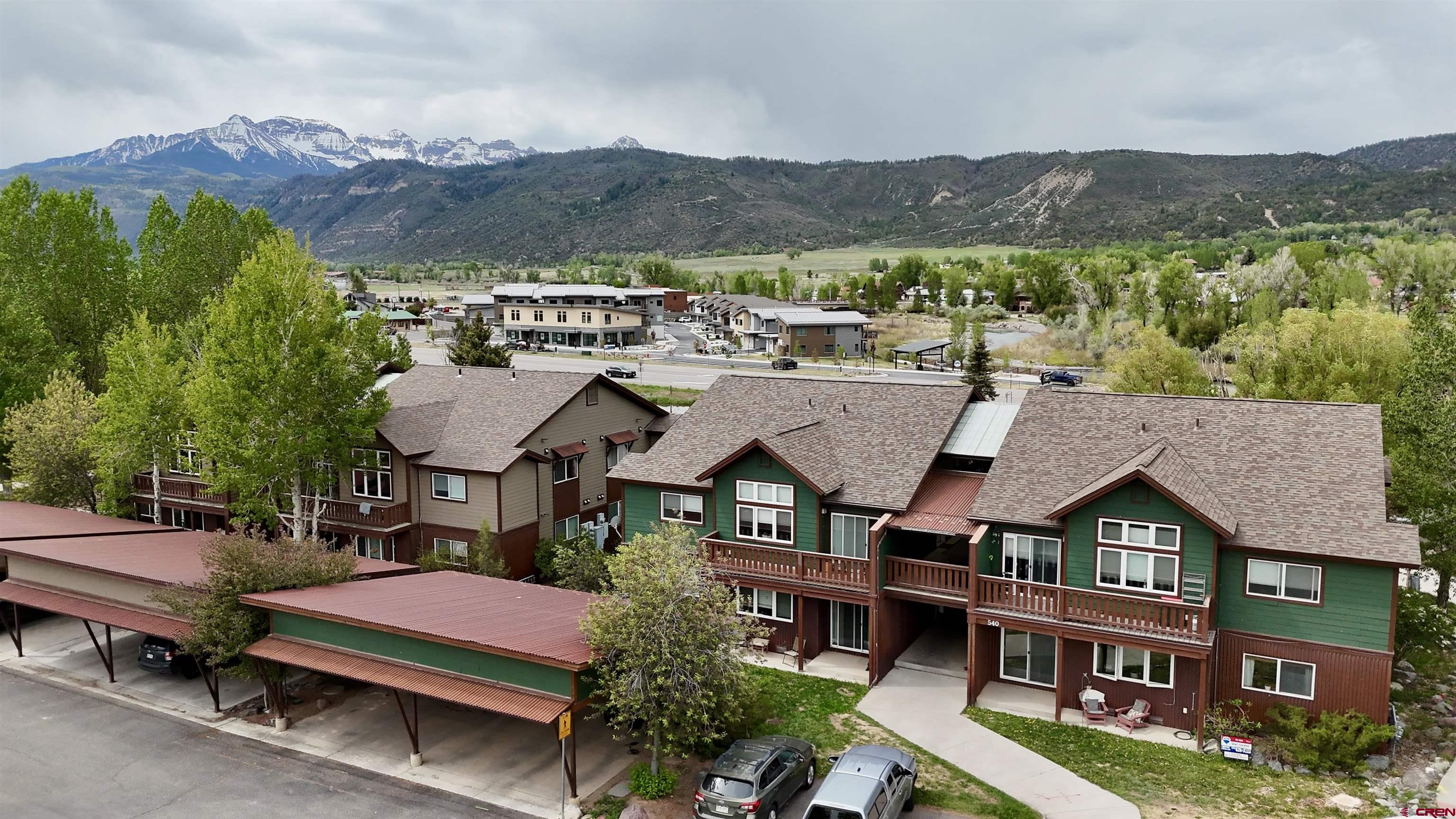 540 Redcliff Circle, Unit E 203 Ridgway, CO 81432 - Photo 30 of 36 an aerial view of a house with a mountain view