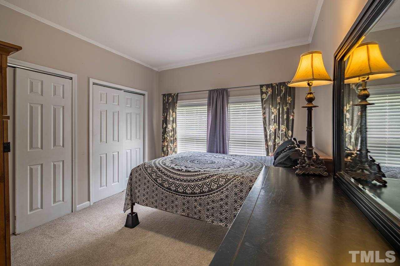 10150 Chambers Road Raleigh, NC 27603 - Photo 14 of 29 a living room with furniture and a large window