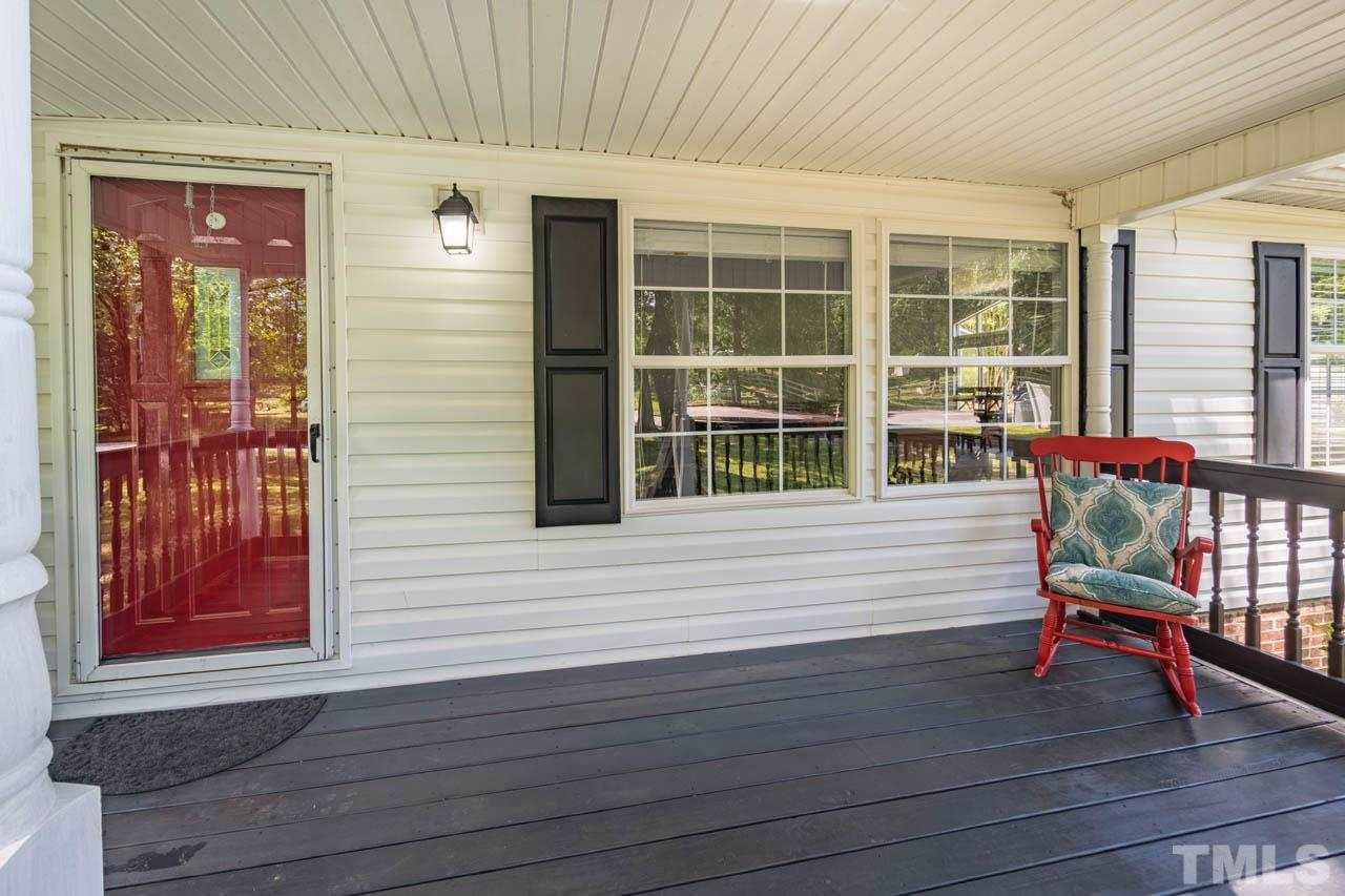 10150 Chambers Road Raleigh, NC 27603 - Photo 4 of 29 a view of a house with wooden deck and furniture