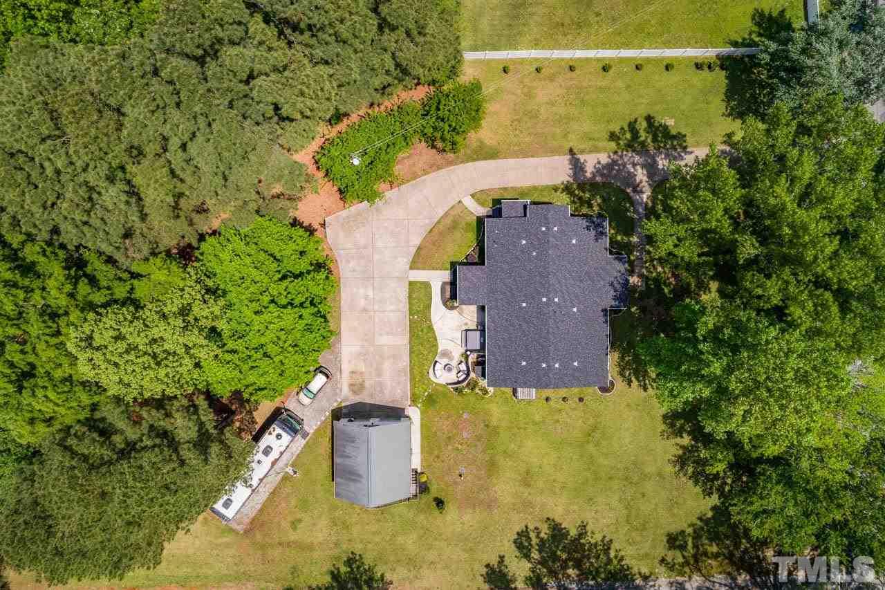 10150 Chambers Road Raleigh, NC 27603 - Photo 5 of 29 an aerial view of a house with a yard swimming pool and outdoor seating