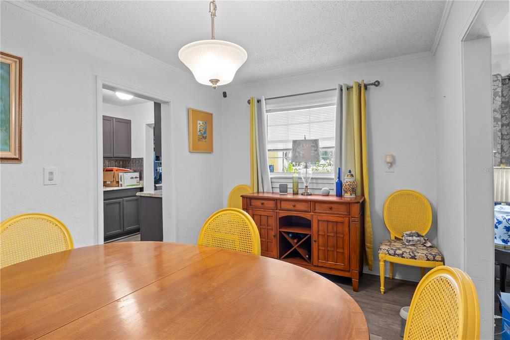 1110 27th Avenue West Bradenton, FL 34205 - Photo 16 of 28 a bedroom with a bed and a chandelier