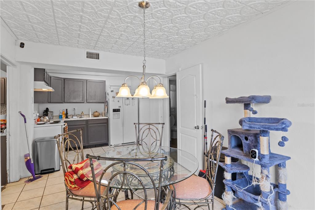 1110 27th Avenue West Bradenton, FL 34205 - Photo 20 of 28 a view of a dining room with furniture and a chandelier
