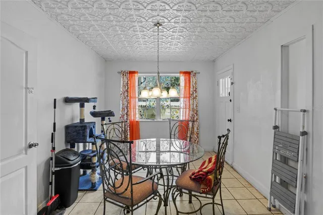 a view of a dining room with furniture window and outside view