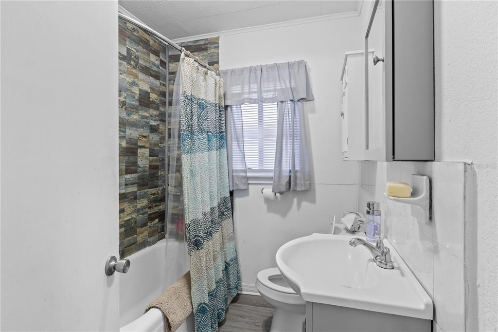 1110 27th Avenue West Bradenton, FL 34205 - Photo 7 of 28 a bathroom with a sink toilet and shower