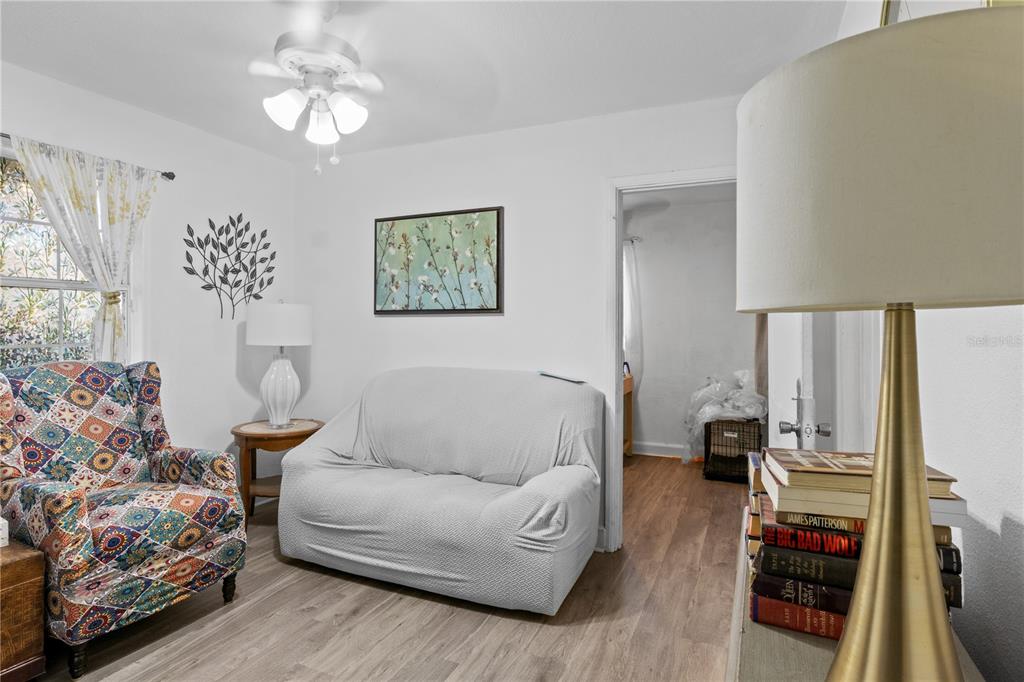 1110 27th Avenue West Bradenton, FL 34205 - Photo 8 of 28 a living room with furniture and a chandelier