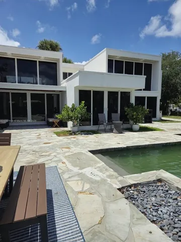 a front view of a house with swimming pool