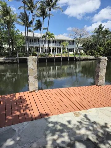 a view of a lake with a house next to a lake