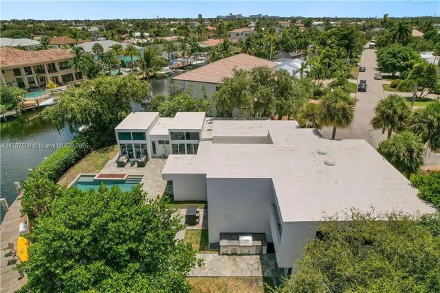an aerial view of a house with a garden