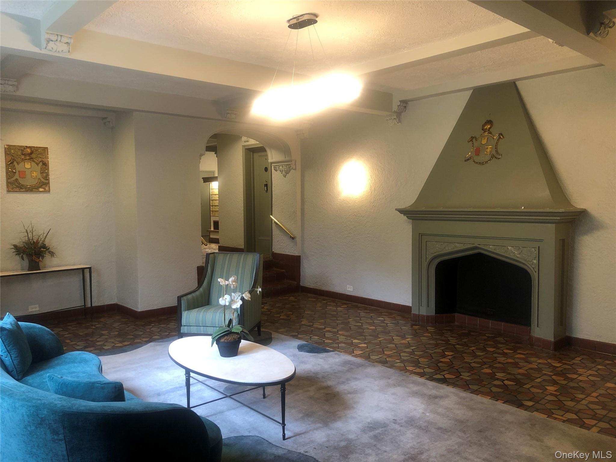 1470 Midland Avenue, Unit 3M Bronxville, NY 10708 - Photo 3 of 11 a living room with furniture and a fireplace