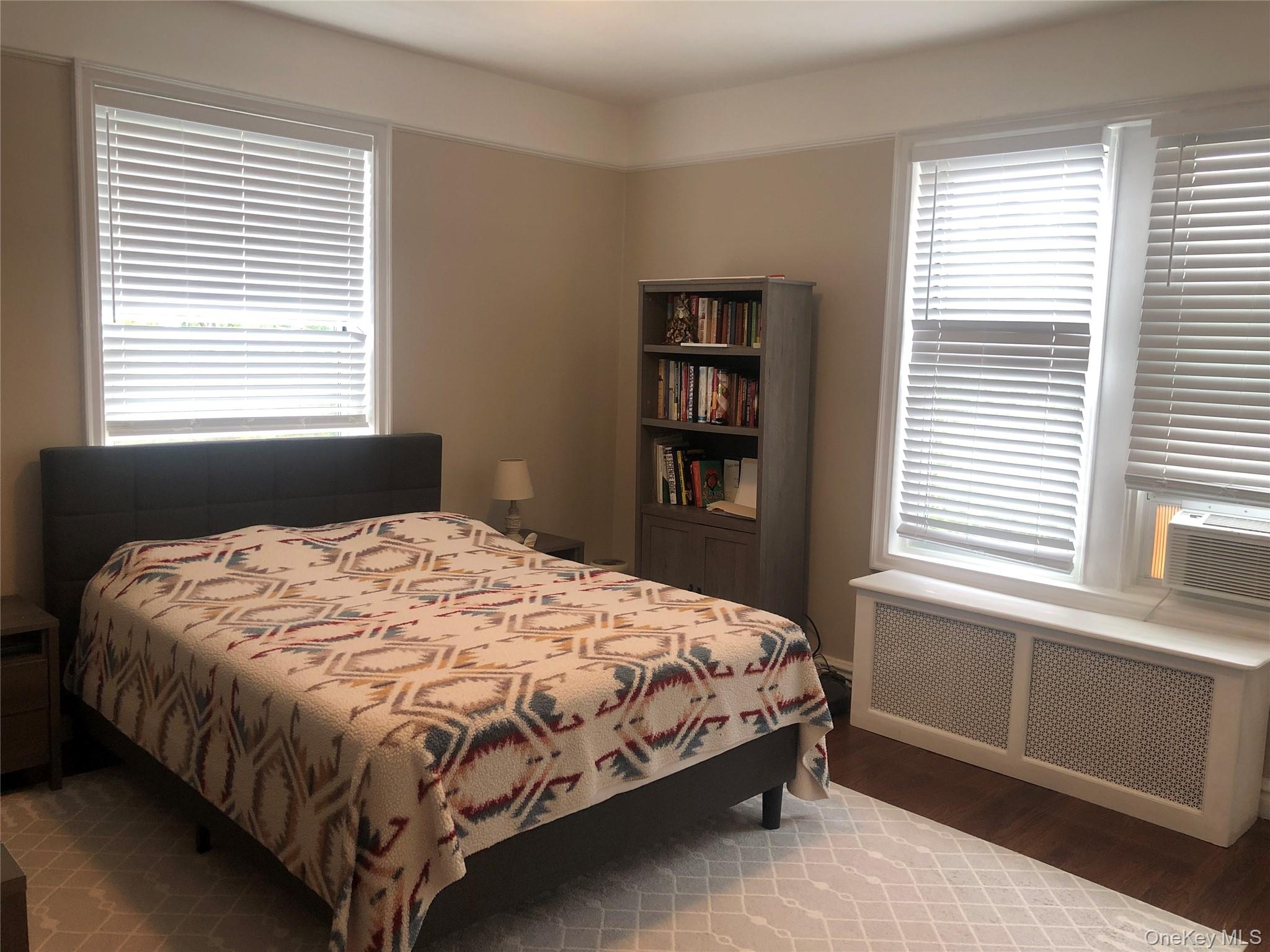 1470 Midland Avenue, Unit 3M Bronxville, NY 10708 - Photo 9 of 11 a bedroom with a bed and a window