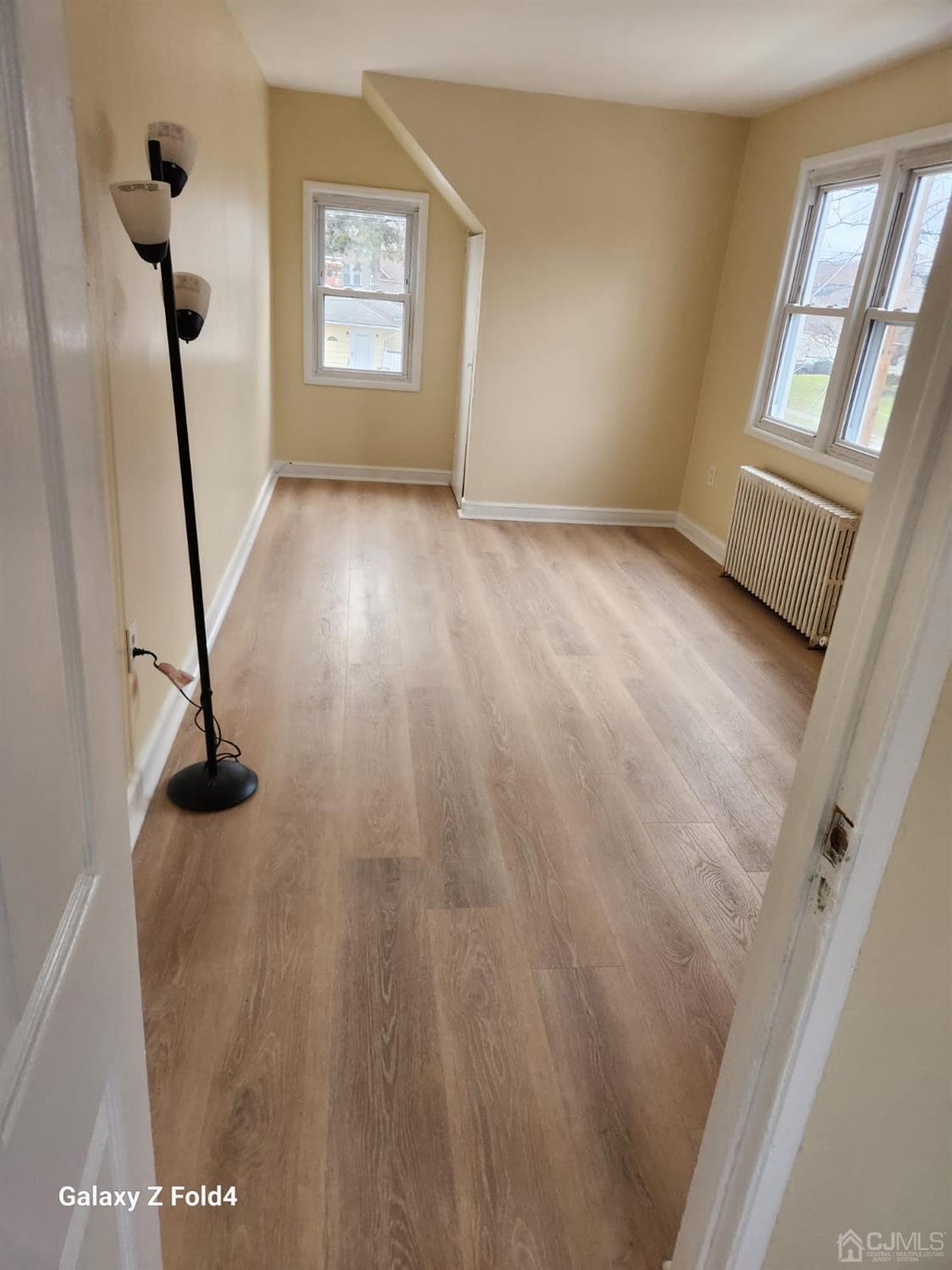 307 2nd Street Middlesex, NJ 08846 - Photo 3 of 8 a view of empty room with windows