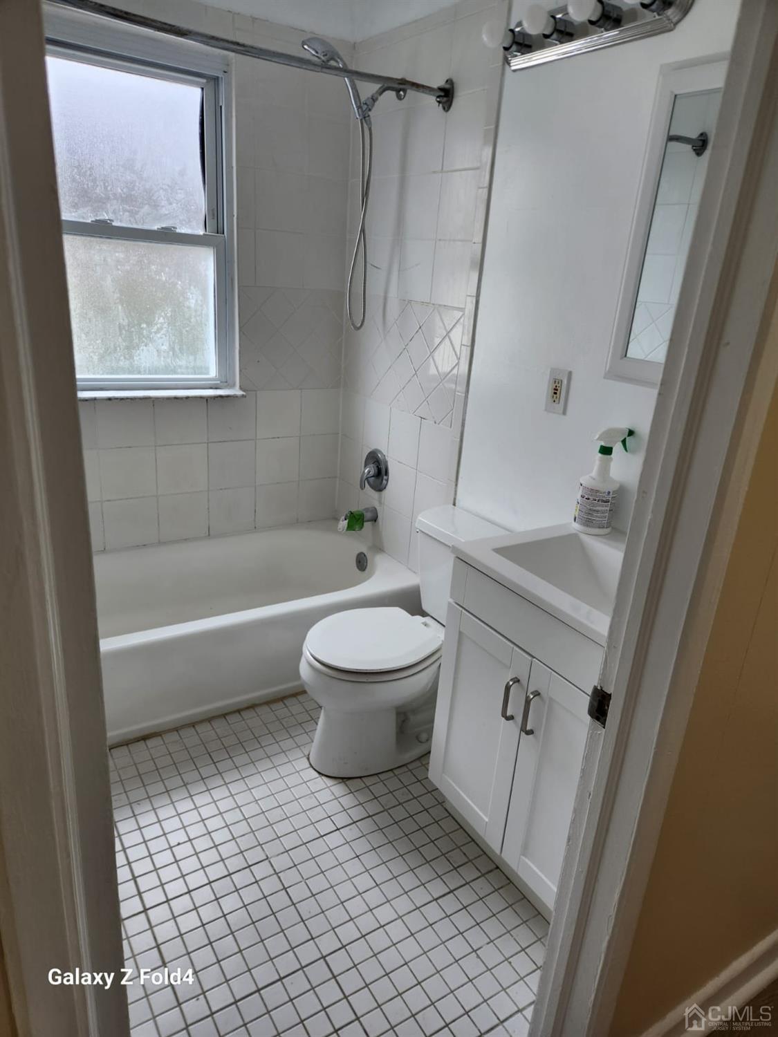 307 2nd Street Middlesex, NJ 08846 - Photo 8 of 8 a bathroom with a sink a toilet and shower
