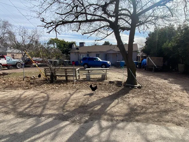 a view of a backyard with sitting area