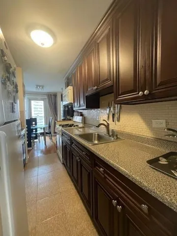 a kitchen with lots of counter top space and a sink