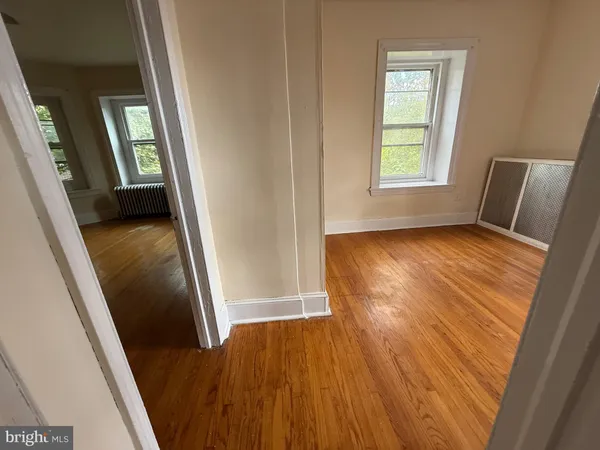 a view of an entryway with wooden floor