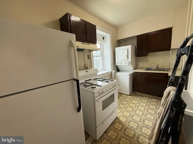 a kitchen with stainless steel appliances a stove a microwave and a refrigerator