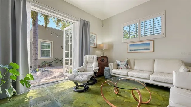 a bedroom with a bed and a large mirror