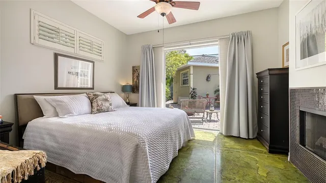 a bathroom with a granite countertop sink a mirror and shower