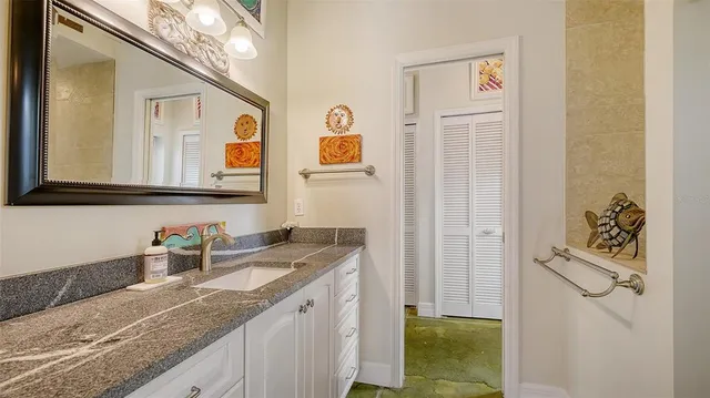 a view of a house with potted plants in front of door