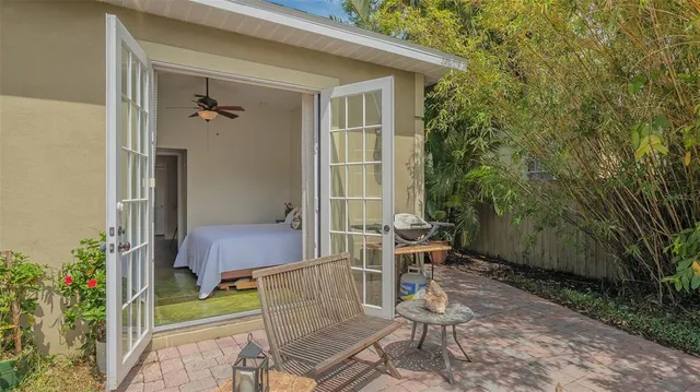 a bedroom with a bed and a mirror