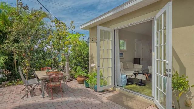 a living room with furniture a flat screen tv and a wooden floor