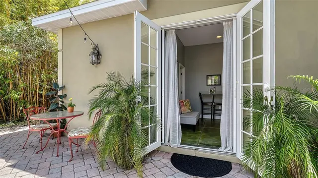 an aerial view of a house with a yard basket ball court and outdoor seating
