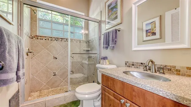 a view of a lake with a house in the background