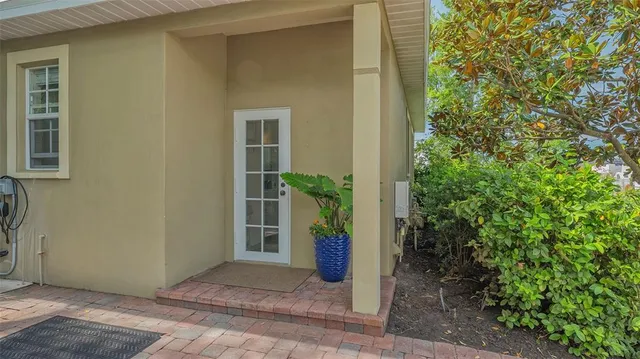 a kitchen with granite countertop a sink a counter space appliances and cabinets