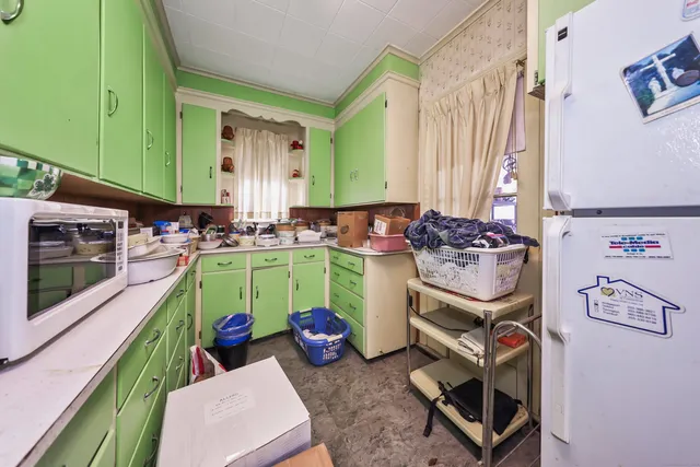 a room with washing machine and a window