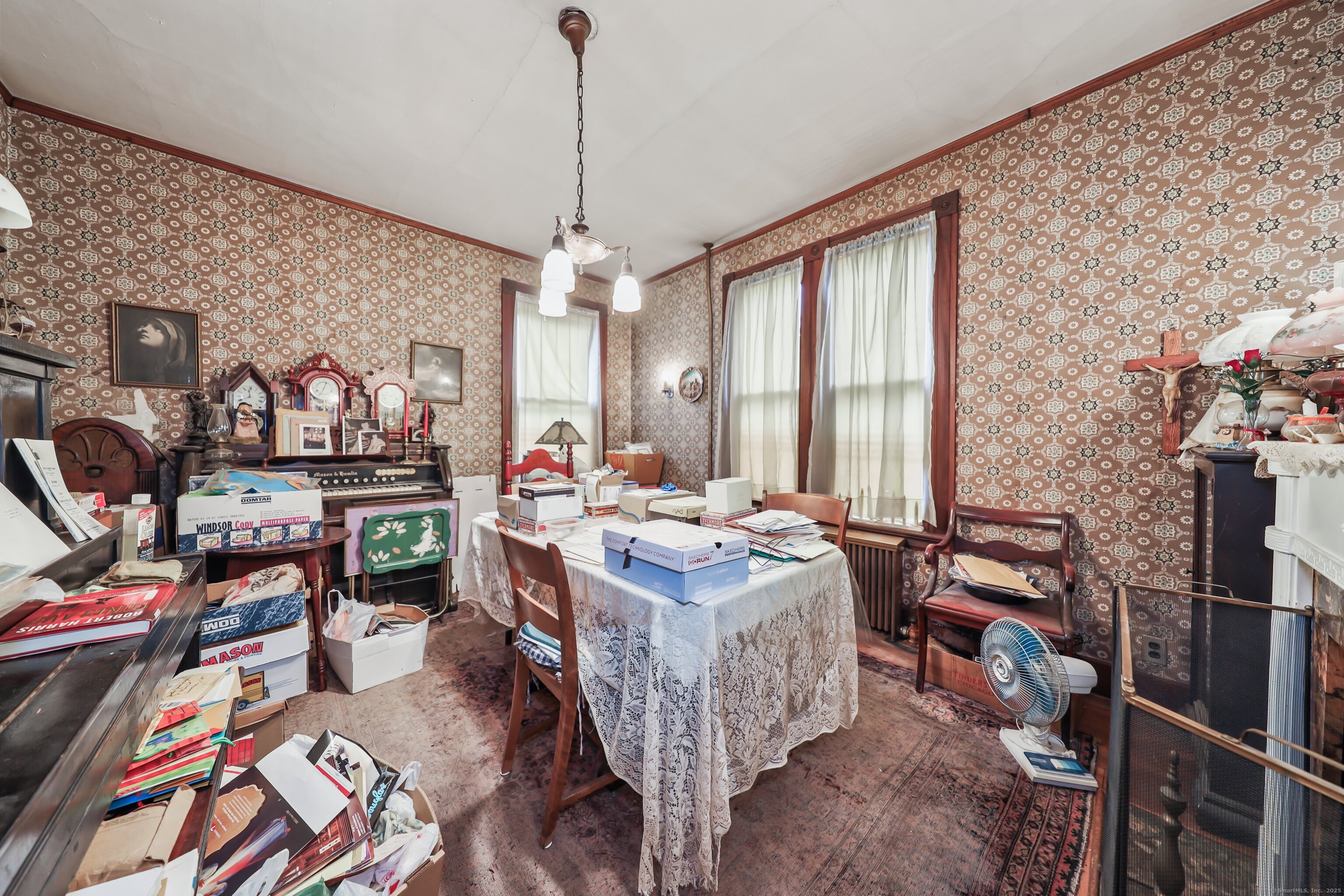 47 Cottage Avenue Ansonia, CT 06401 - Photo 15 of 38 a bed room with a bed furniture and a chandelier