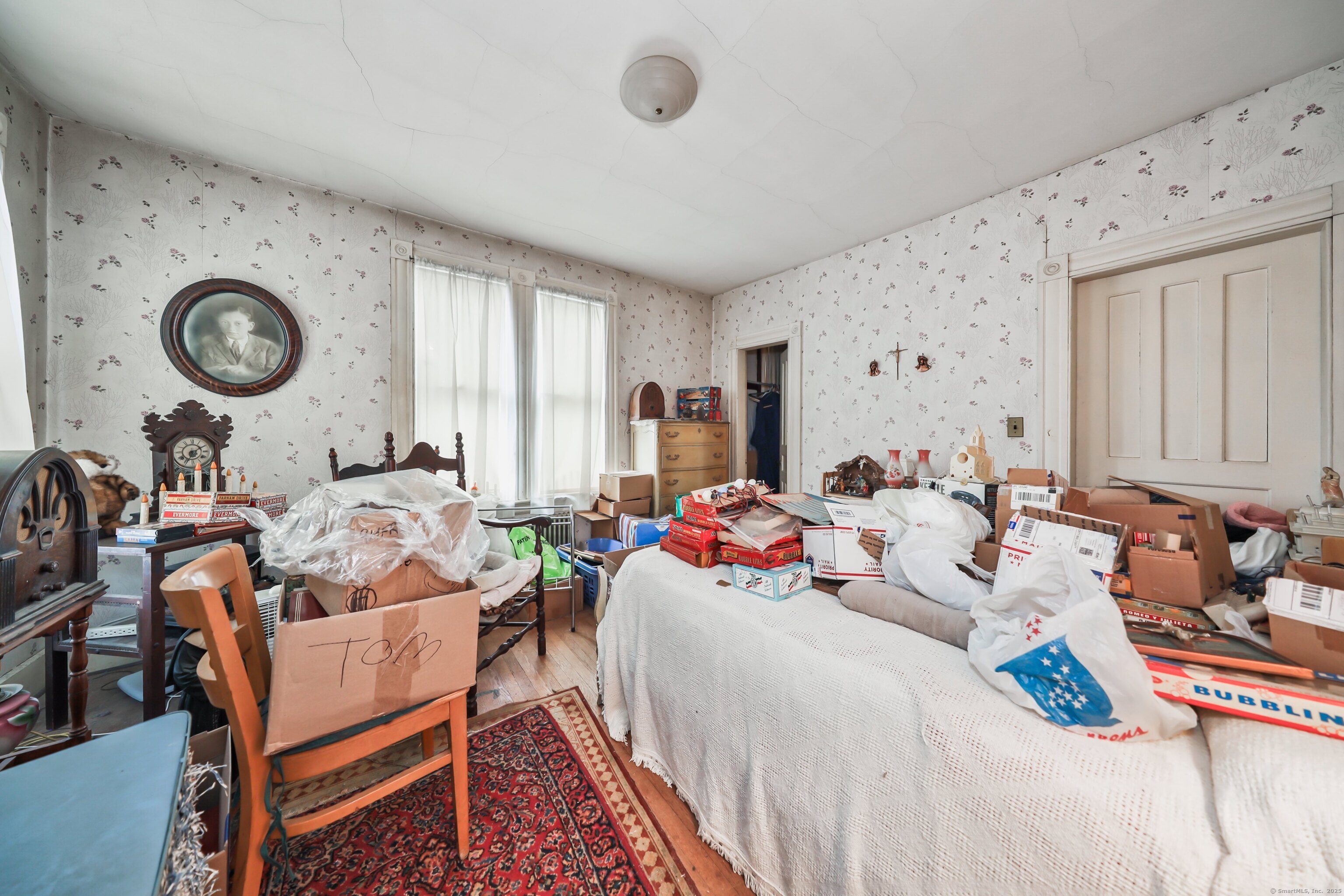47 Cottage Avenue Ansonia, CT 06401 - Photo 22 of 38 a bed room with a bed mirror and a window