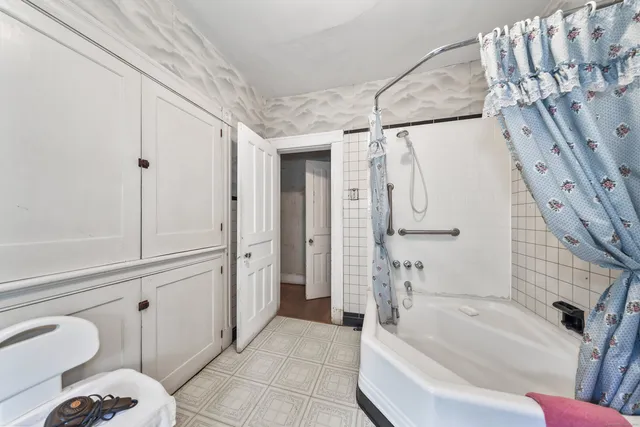 a view of a living room and entryway