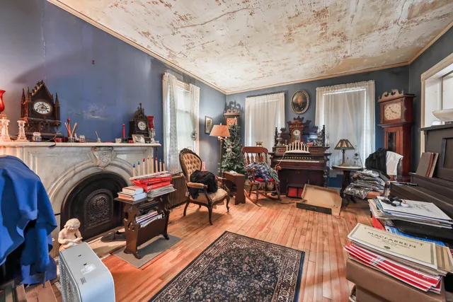a living room with furniture a rug and a fireplace