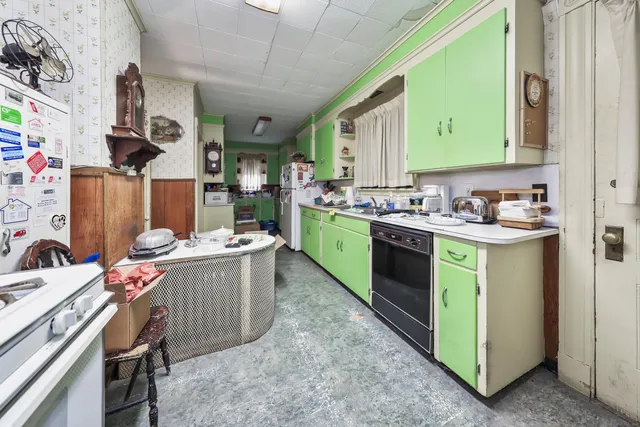 a kitchen with a sink stove and cabinets