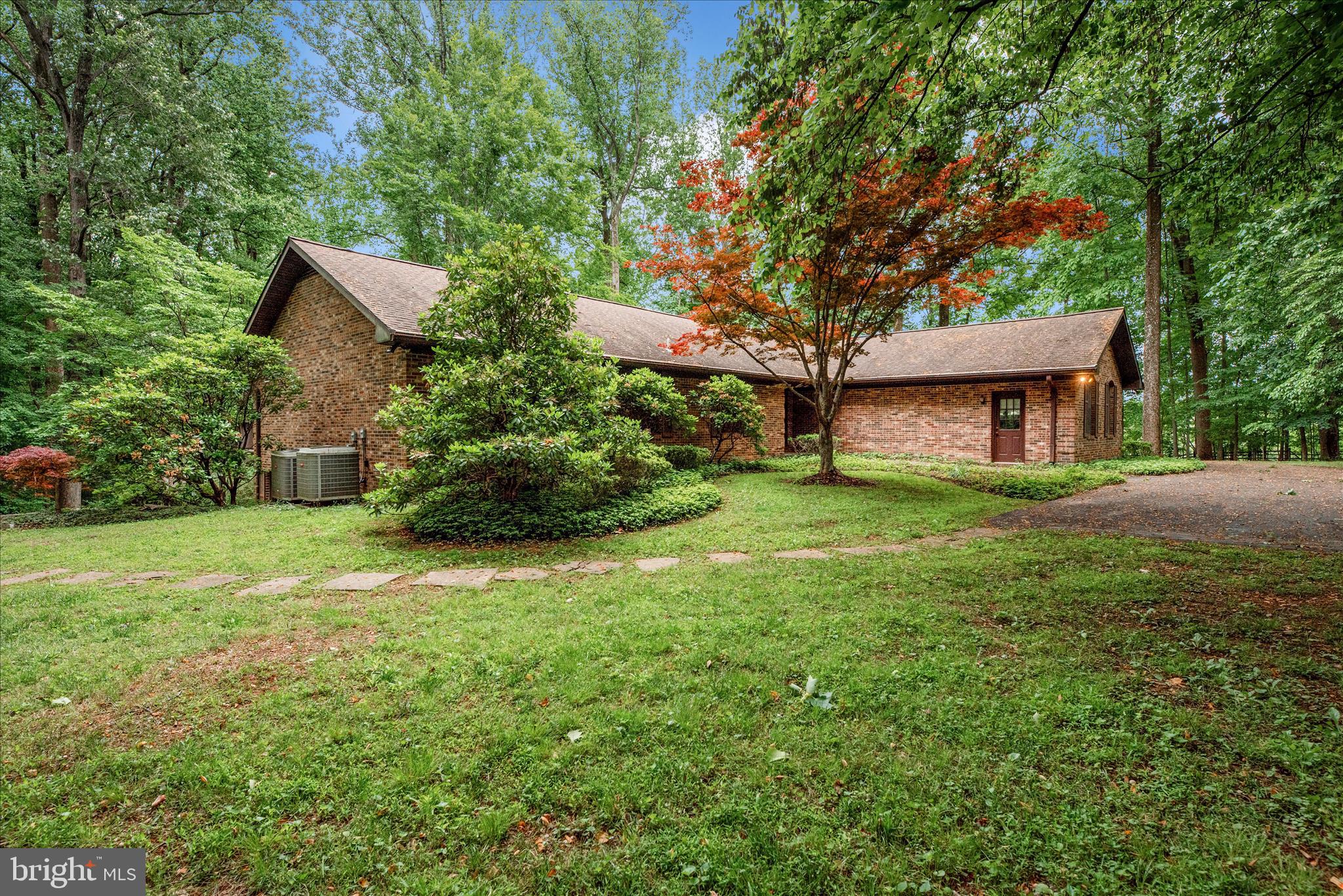 2221 Gold Mine Road Brookeville, MD 20833 - Photo 55 of 60 a front view of a house with garden