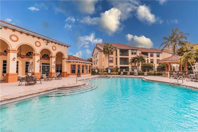 a view of building with outdoor space and seating area
