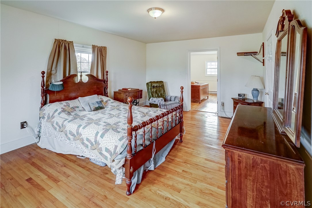 17110 Egglestetton Road Amelia Court House, VA 23002 - Photo 14 of 50 a bedroom with furniture and a wooden floor