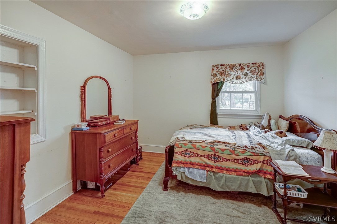 17110 Egglestetton Road Amelia Court House, VA 23002 - Photo 15 of 50 a bedroom with a bed and a table in it