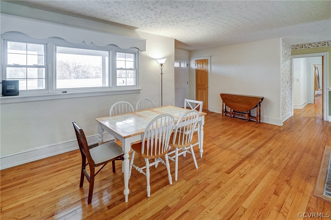 17110 Egglestetton Road Amelia Court House, VA 23002 - Photo 6 of 50 a dining room with furniture and wooden floor