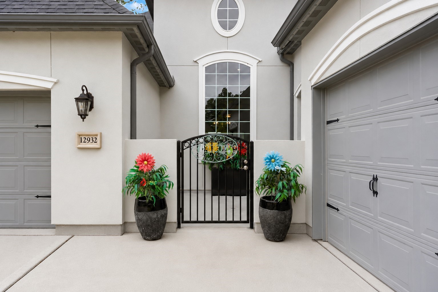 12932 Whitewater Way Conroe, TX 77302 - Photo 2 of 48 Tucked behind the wrought iron fence is a charming private courtyard.