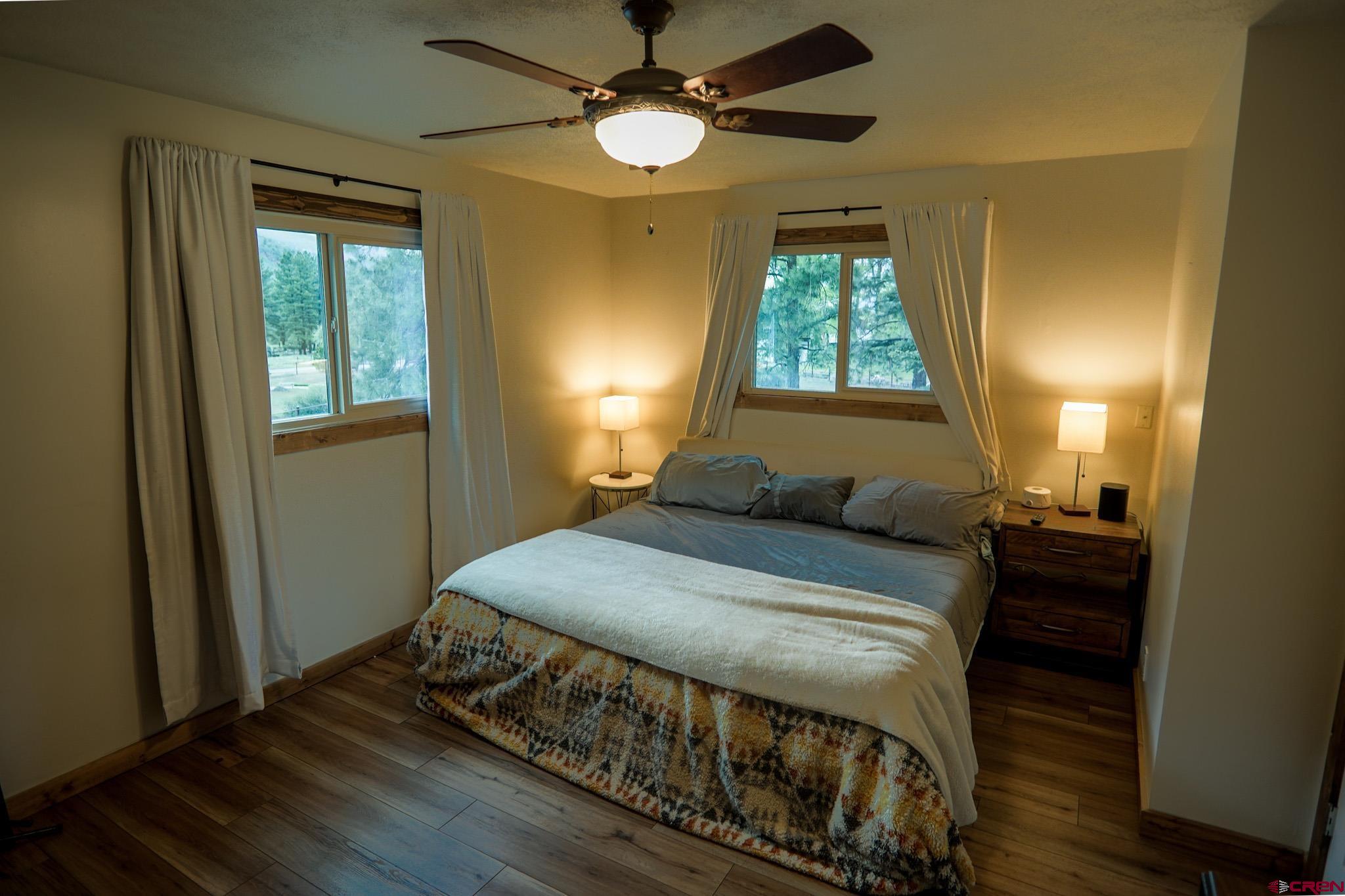 559 Suzanne Lane Ridgway, CO 81432 - Photo 22 of 45 a bedroom with a bed and a window