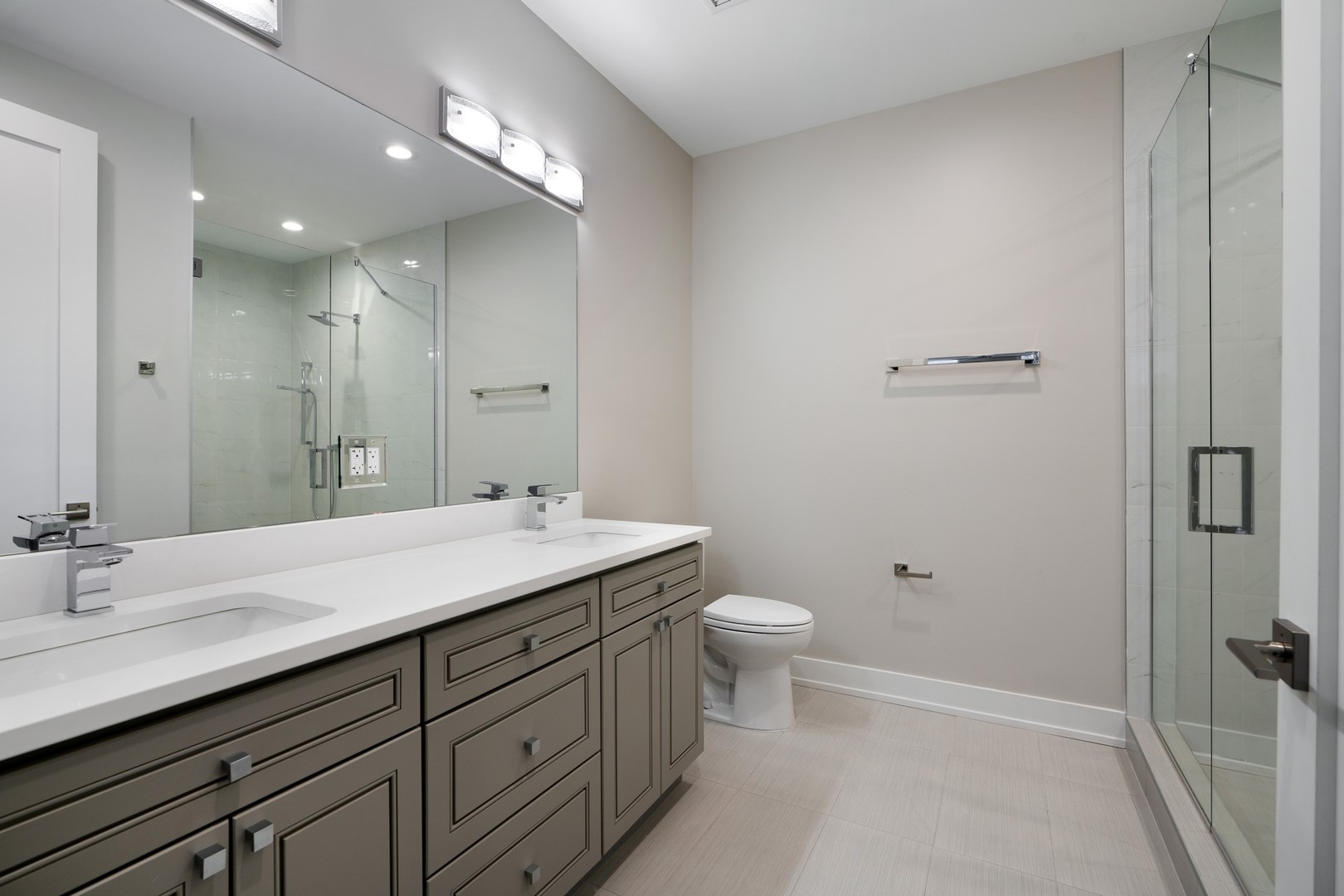 236 South Racine Avenue, Unit 304 Chicago, IL 60607 - Photo 12 of 23 a bathroom with a granite countertop sink mirror and toilet