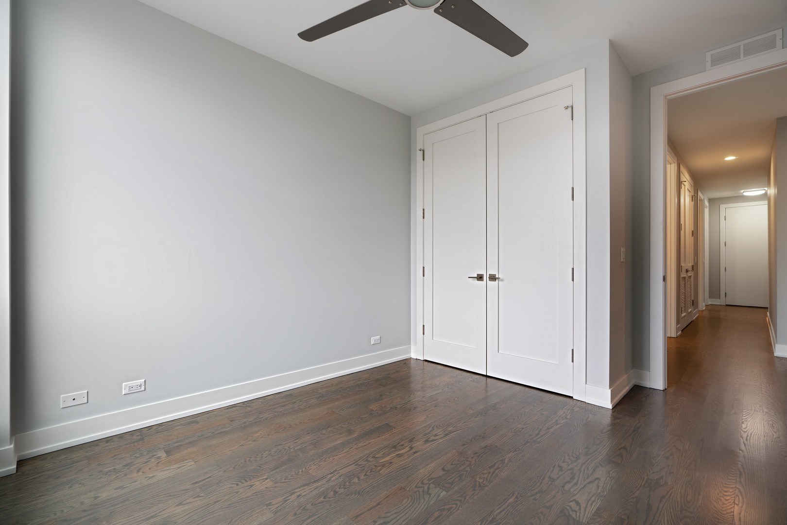 236 South Racine Avenue, Unit 304 Chicago, IL 60607 - Photo 15 of 23 a view of an empty room with wooden floor