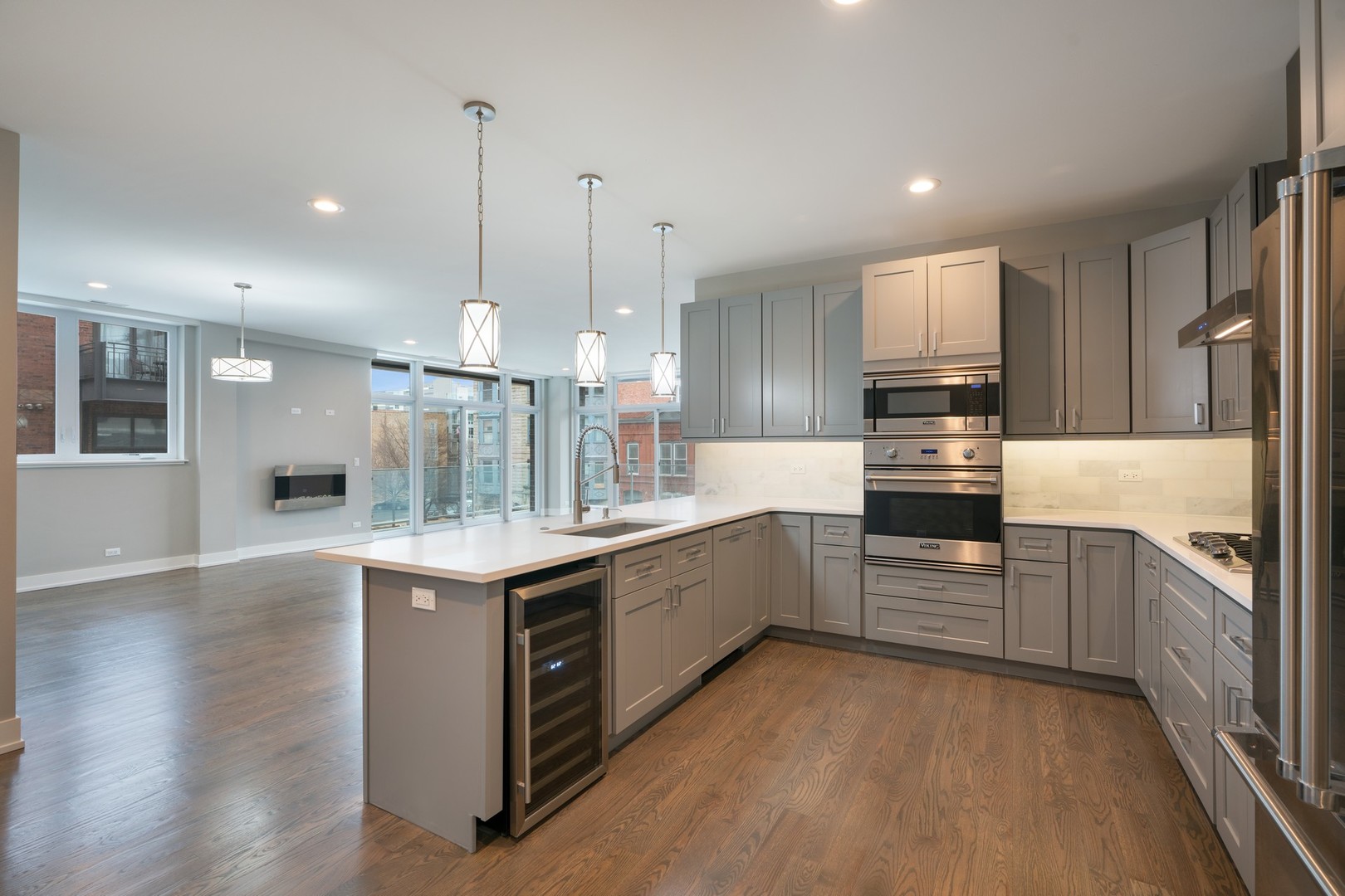 236 South Racine Avenue, Unit 304 Chicago, IL 60607 - Photo 4 of 23 a kitchen with stainless steel appliances granite countertop a sink a stove and a refrigerator