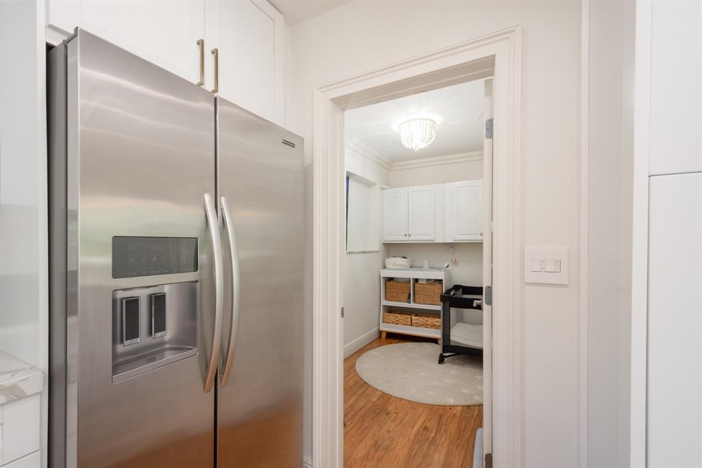 2800 Northeast 21st Avenue Lighthouse Point, FL 33064 - Photo 18 of 58 a kitchen with a refrigerator and a sink