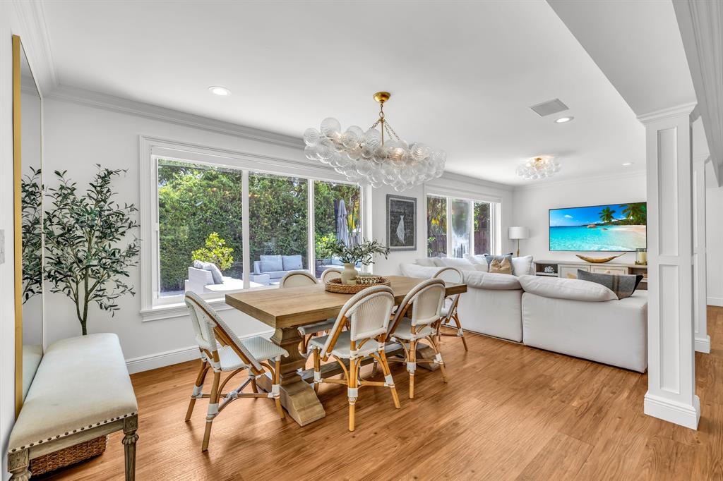 2800 Northeast 21st Avenue Lighthouse Point, FL 33064 - Photo 20 of 58 a view of a dining room with furniture window and wooden floor