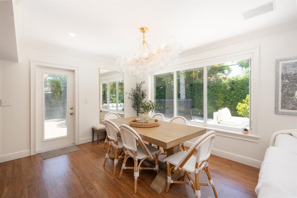2800 Northeast 21st Avenue Lighthouse Point, FL 33064 - Photo 22 of 58 a view of a dining room with furniture window and wooden floor